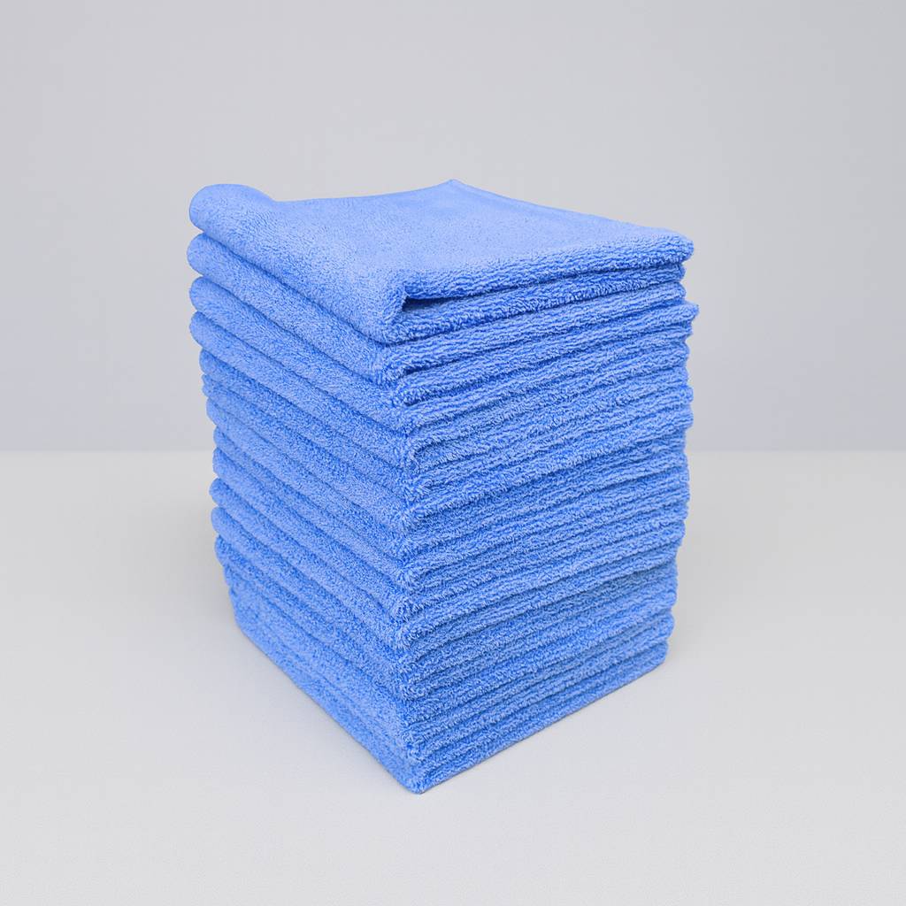 Stack of blue microfiber cloths on a light gray background